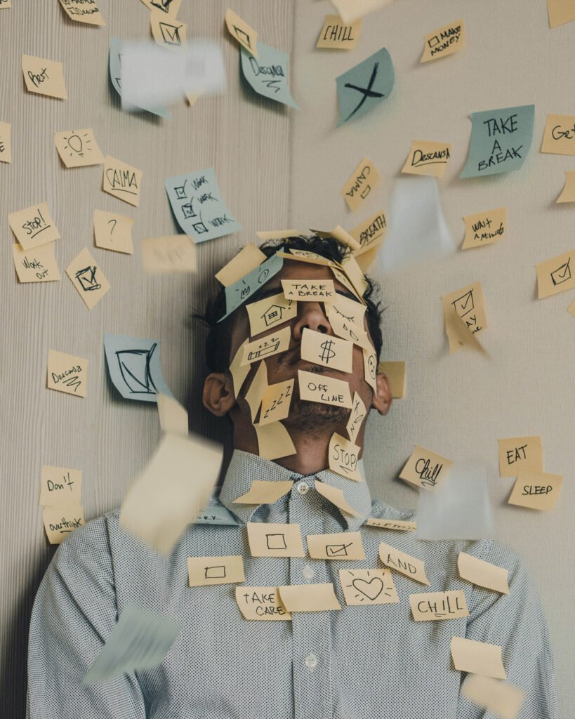 Stressed Man Covered in Post It Notes