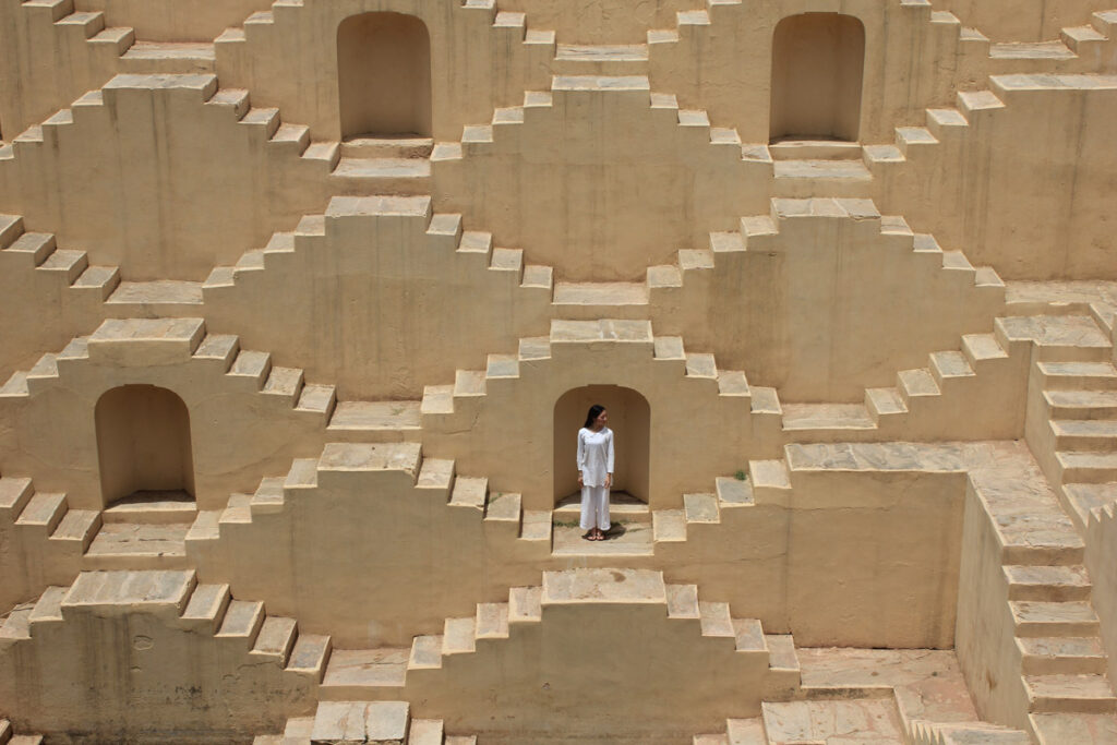 Woman on stairs with many possible directions