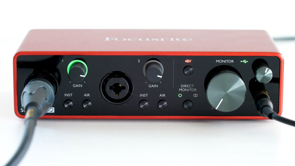 Focusrite Scarlett 2i2 with mic and headphones plugged in