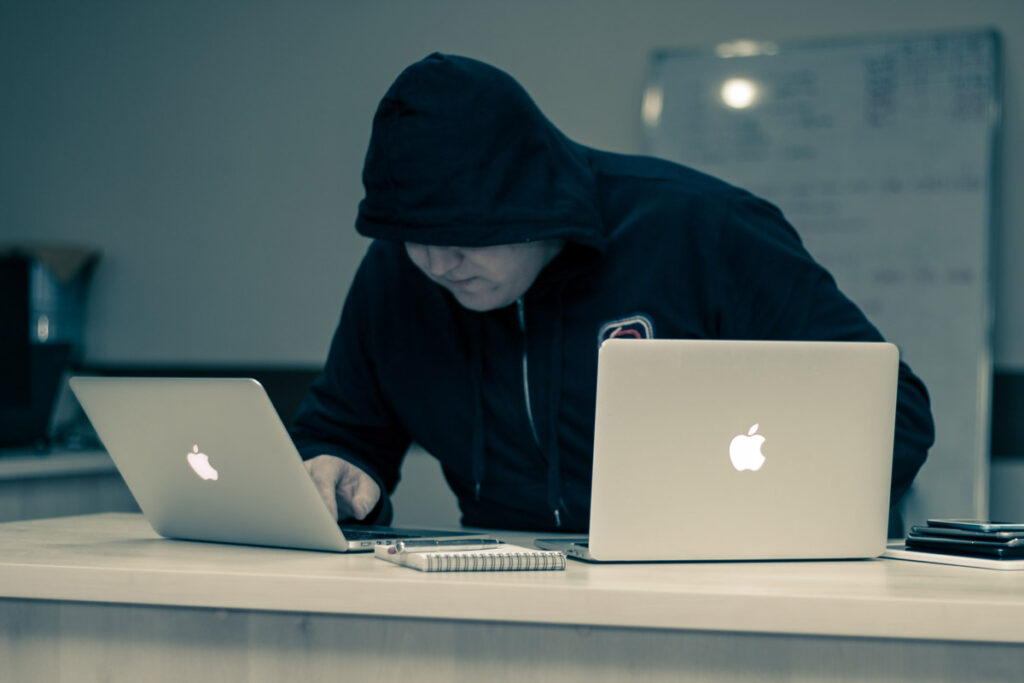 shady guy on 2 macbooks